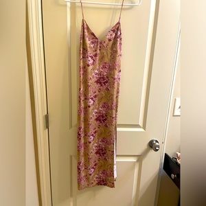 A beautiful midi dress with a slit. The brand is Lovely Day, never been worn.